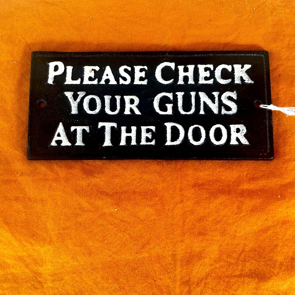 Cast Iron Wall Plaque “Please Check Your Guns At The Door”